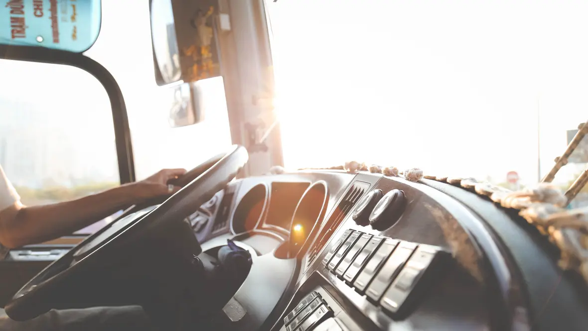 canva-person-hand-on-steering-wheel
